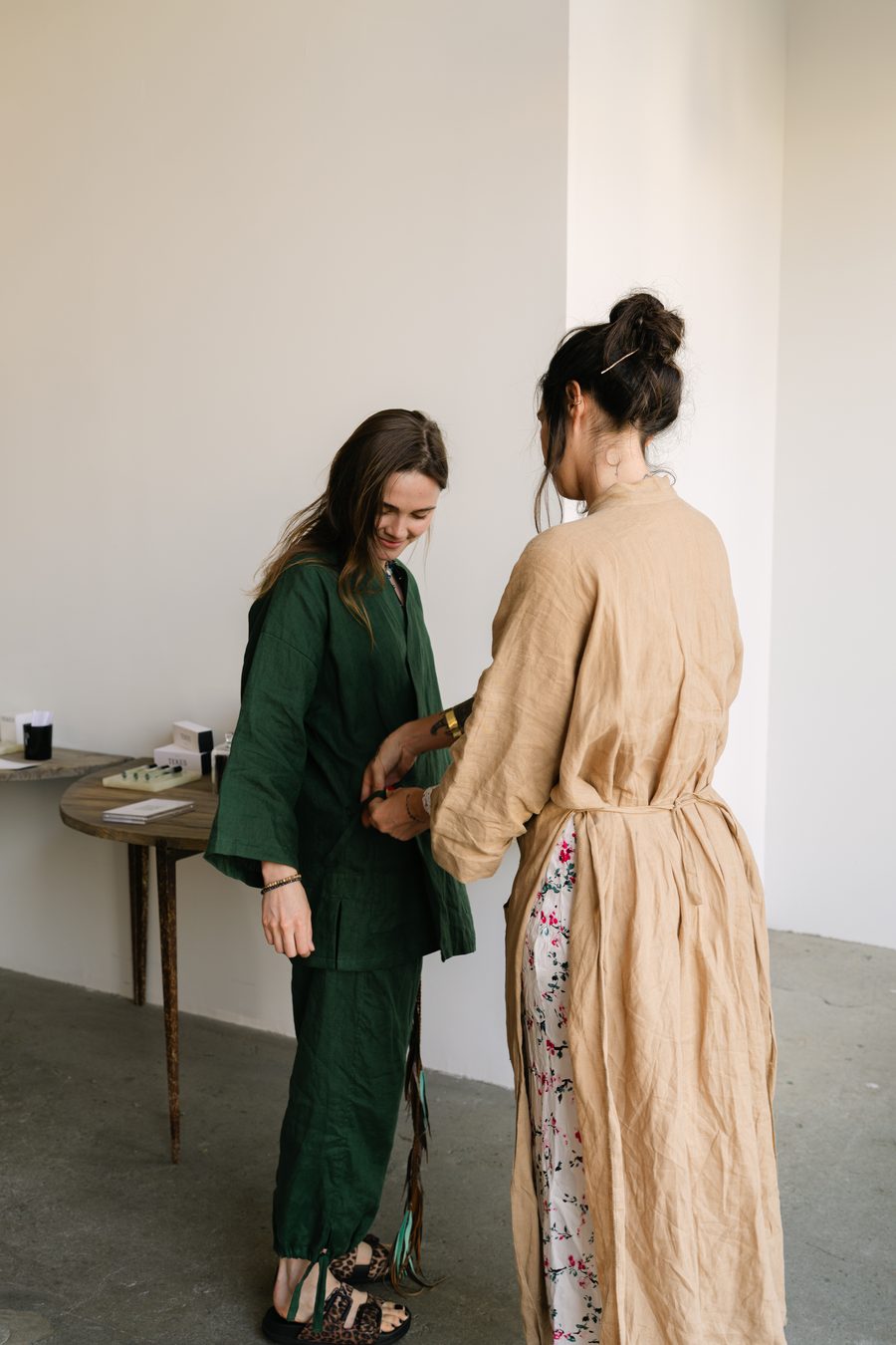 Two figures in robes, mid-conversation